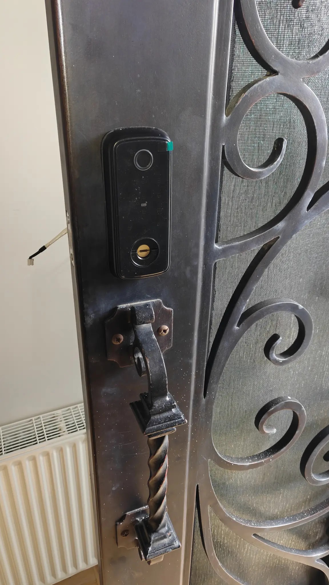Smart lock retrofit on existing security door in Caulfield South