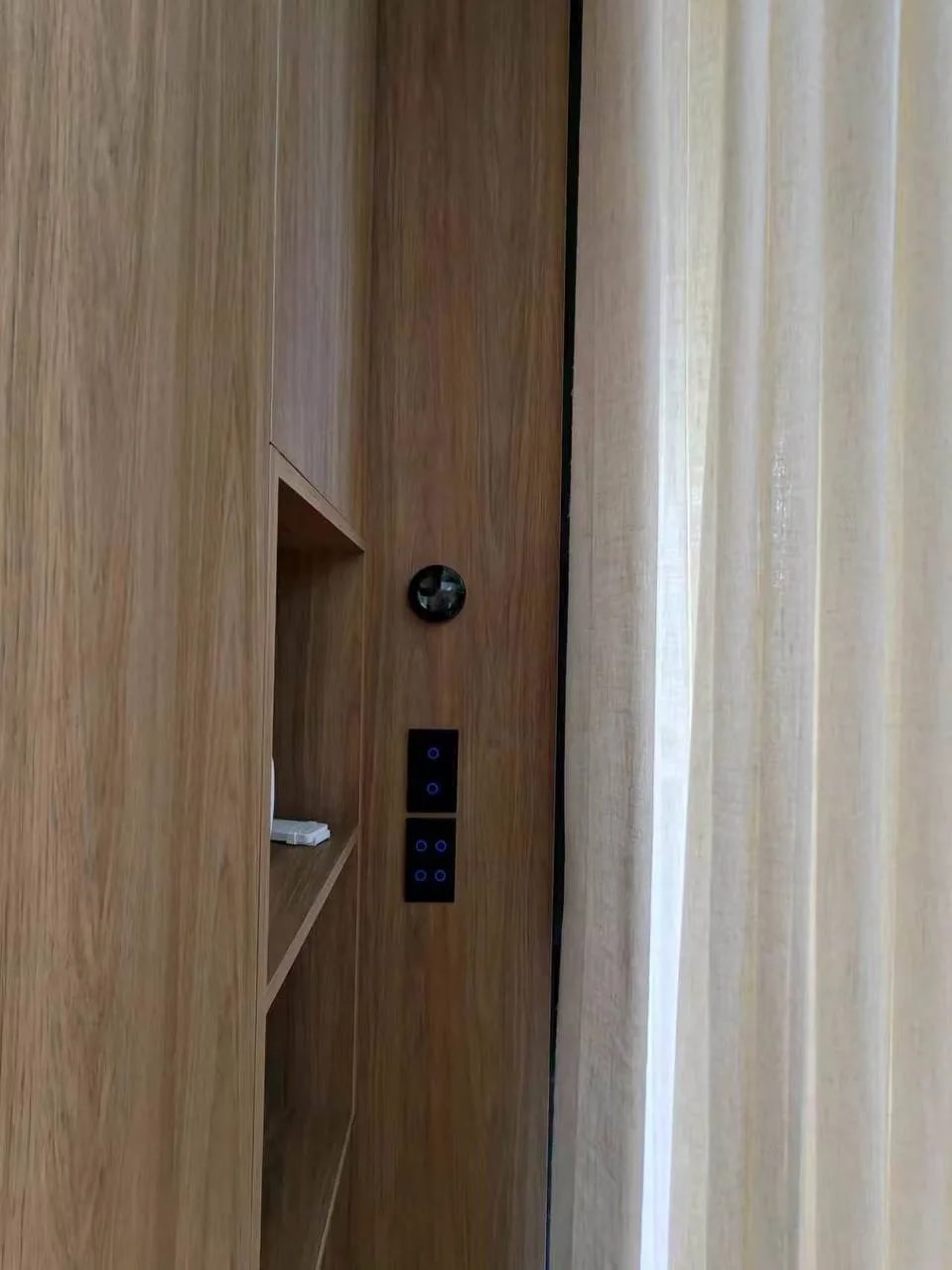 Occupancy sensor and black touch controls set into walk-in wardrobe timber cabinetry