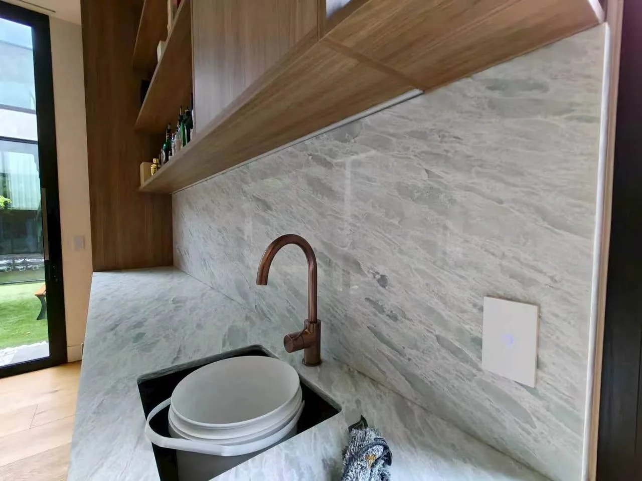 White control panel integrated with a light stone finish.