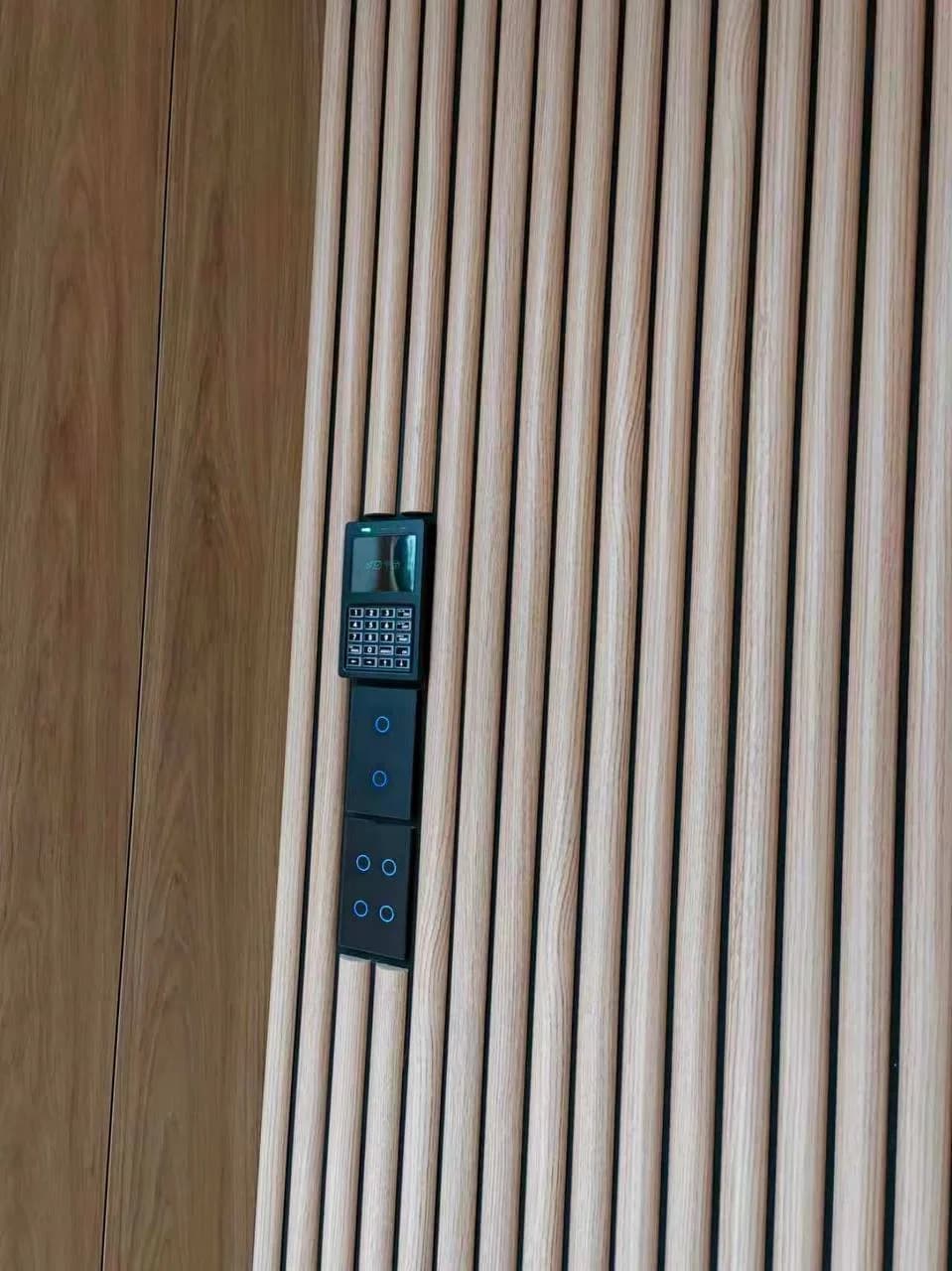 Black controls integrated into timber joinery.